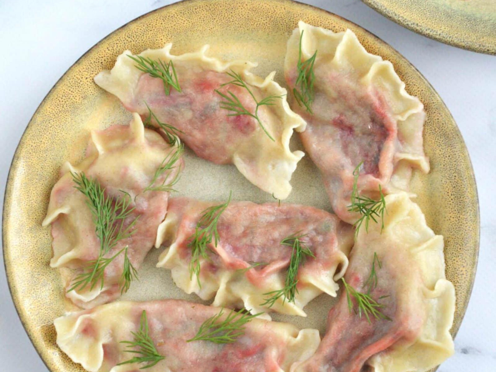 Orkiszowe pierogi z botwiną i fetą