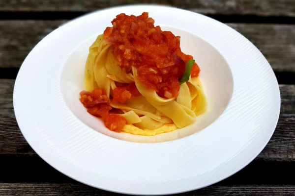 Buttered basil tagliatelle with tomato and chilli sauce and cheddar sauce
